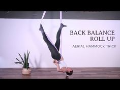 a man is doing acrobatic tricks on a pole