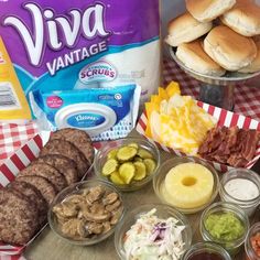 an assortment of food on a table with the words via vantage burger bar ideas above it