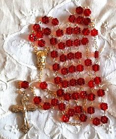 "See more of our rosaries at https://prayertoolbox.etsy.com Offering you a handmade new glass bead rosary made in the Czech Republic.  The 8mm diameter floral beads are transparent red in color.  Gold finish.  Italian made & designed crucifix measures 1.5\" long x 1\" wide.  Rosary length is 23\" long.   Comes gift boxed with card of origin." Red Rosary Beads For Jewelry Making, Handmade Red Rosary For Jewelry Making, Red Beaded Rosary With Round Beads, Red Beaded Rosary For Spiritual Use, Red Spiritual Rosary As Gift, Handmade Red Rosary With Cross, Handmade Red Rosary, Handmade Red Cross Rosary, Flower Rosary