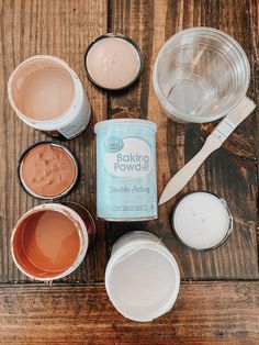 the ingredients for making cake sitting on top of a wooden table next to each other