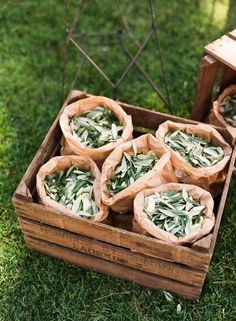 some food is sitting in a wooden box on the grass and ready to be eaten