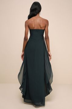 the back of a woman wearing a black strapless dress