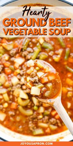 hearty ground beef vegetable soup in a white bowl with a wooden spoon and text overlay