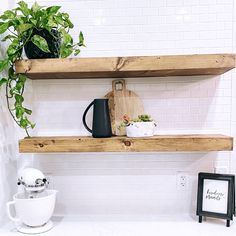 two wooden shelves with plants on them and a cutting board in front of the shelf