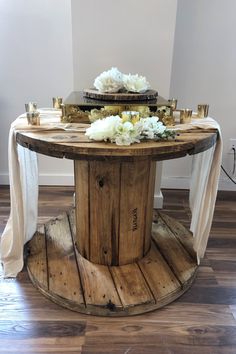 a wooden table with flowers on it