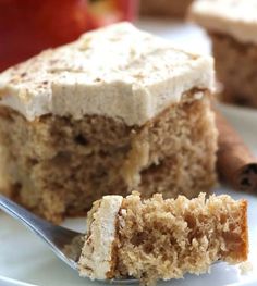 a close up of a piece of cake on a plate with a fork next to it