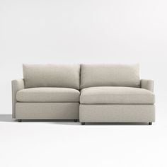 a white couch with a chaise lounger on it's back and side