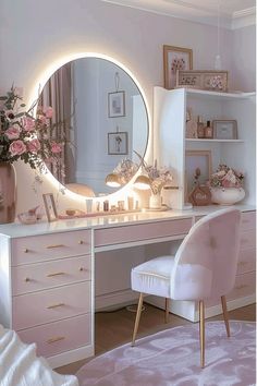 a white desk with a mirror on top of it next to a chair and flowers