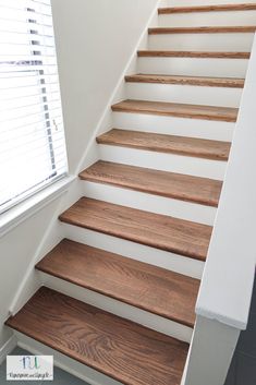 the stairs are made of wood and white paint