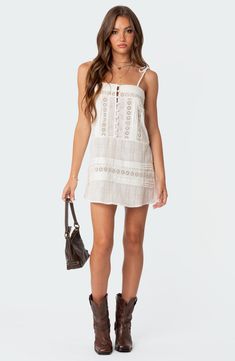 This breezy cotton mini is designed with airy eyelets and dainty tie straps. Square neck Tie straps 100% cotton Machine wash, dry flat Imported Cotton Lace Fabric, Dress Layered, Swimwear Dress, Layered Skirt, Fragrance Design, Skirt Design, Lace Mini Dress, Sam Edelman Shoes, White Mini Dress