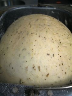 an uncooked dough in a metal pan