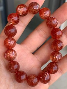 Material:  Arusha sunstone beads  size :  12mm hole size 1mm   quantity: one strand  6mm approx 29 pcs one strands 7mm approx25 pcs one strands 8mm approx 22 pcs one strands 9mm approx 21pcs one strands 10mm approx 19 pcs one strands 11mm approx 18pcs one strands 12mm approx 16 pcs one strands 13mm approx 16 pcs one strands 14mm approx 15 pcs one strands 15mm approx 14pcs one strands 16mm approx 14 pcs one strands 17mm approx 13pcs one strands 18mm approx 13pcs one strands 19mm approx 12pcs one strands 20mm approx 12pcs one strands PLEASE NOTE: 1.Due to lighting effects, monitor's brightness/contrast settings etc, there could be some slight differences in the color tone of the pictures and the actual item. 2.Each piece of natural crystal is unique, the imperfections add natural characters Amber Gemstone Beaded Bracelets, Amber Crystal Bracelet With 8mm Beads, Amber Bracelets With 8mm Round Beads, Spiritual Orange Crystal Bracelet With Round Beads, Arusha, Women Bracelet, Teardrop Beads, Strawberry Quartz, Beads Bracelet