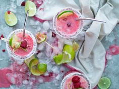 two glasses filled with raspberry lime margaritas