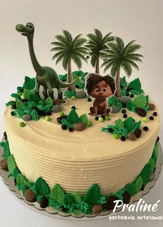 a birthday cake decorated with an image of a dinosaur