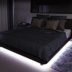 a bed that has some lights on it