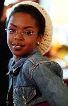 a woman wearing glasses and a knitted hat