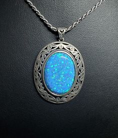 Huge Beautiful Blue Opal Necklace, 18x25mm Lab Created Blue Opal With Green And Lavender Fire, See Video! 925 Sterling Silver Vintage Style, Bezel Setting, Antique Finish Sterling With Sterling Chain. Gift Box Included. Blue Jewelry With Large Pendant For Formal Occasions, Formal Blue Jewelry With Large Pendant, Blue Gemstone Oval Pendant Jewelry, Oval Blue Jewelry As A Gift, Oval Blue Jewelry For Gifts, Blue Oval Jewelry For Gifts, Oval Sapphire Cabochon Necklace, Oval Sapphire Necklace With Cabochon Cut, Formal Blue Oval Pendant Necklace