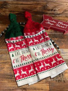 three christmas napkins on a wooden table