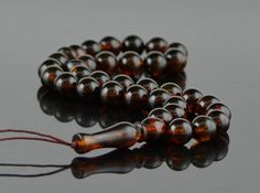 This is a wonderful Baltic amber rosary which is designed for Muslims. Amber is pressed but natural. Extruded means that the amber is made of fine amber dust and combined into one whole. From the pieces you will not even notice that they are made of pressed amber because of the very high quality. Pressed amber is very suitable for those who want to have the highest quality at a low price. We also supply wholesale rosaries, so you can be sure that we are not only manufacturers of unit products bu Beads Mala, Amber Beads, Mala Beads, Prayer Beads, Baltic Amber, Lithuania, Malta, Rosary, Amber