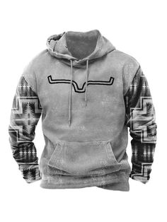 a hooded sweatshirt with an image of a cow skull on the front, and a southwestern pattern on the back