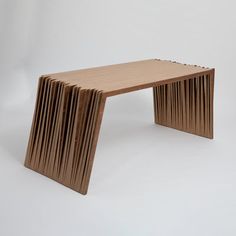 a wooden bench made out of strips of wood