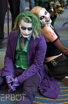 two people dressed up as the joker and the person in costume are sitting on carpet