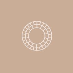 a white circle on a brown background