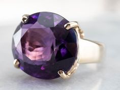 This amethyst cocktail ring makes a big statement! The amethyst is a deep purple hue with glittering tones of fuchsia and lilac. Set into an east to west style mounting, the gemstone is complimented beautifully by the warmth of the yellow gold. This ring is stylish and glamorous! Metal: 14K Yellow Gold Gem: Amethyst 20.12 Carats Gem Measurements: 17.5 x 19.4 mm, Oval Ring Size: 8.50 Marks: "14K" Stamped on the inside band Yellow Gold Sapphire Ring, Amethyst Cocktail Ring, Right Hand Ring, Princess Jewelry, Woman Jewelry, Amethyst Gold, Gold Cocktail Ring, Cameo Ring, Gold Cocktail