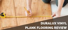 a person measuring the width of a floor with a tape measure on it, and text that reads duralux vinyl plank flooring review