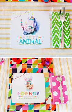 the table is decorated with colorful napkins and place settings for an animal themed birthday party