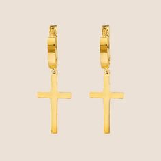 These gold earrings feature a smooth, sleek cross pendant dangling from each hoop. The design is minimalist, highlighting the lustrous finish of the gold. Gold Hoop, Gold Hoop Earrings, Huggies Earrings, Cross Pendant, Gold Earrings, Jewelry Earrings Dangle, Etsy Earrings, Dangle Earrings, Jewelry Earrings