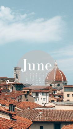 the rooftops and roofs of buildings with a large round sign that reads june on it