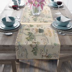 the table is set with place settings, plates, and napkins for two people to sit at