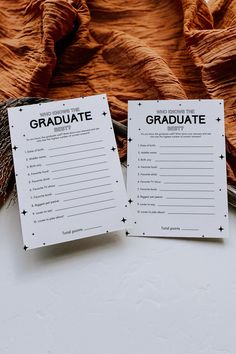 two printable graduation games sitting on top of a table