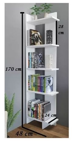 the book shelf is white and has four shelves with books on each side, along with a plant