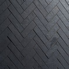 an image of a black tile pattern that looks like it is made out of bricks