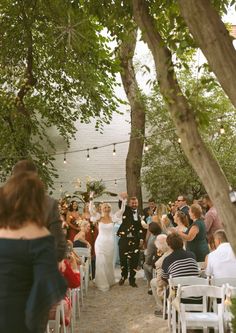 a newly married couple walking down the aisle