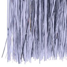 an abstract photo of white and grey grass with long thin strips on the bottom right side