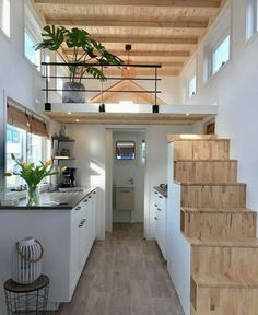 the interior of a tiny house with stairs