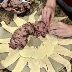 a person is making some food on a plate