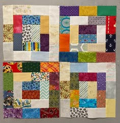 a patchwork quilt with many different colors and patterns