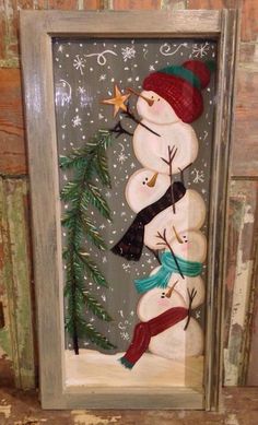 a snowman made out of wood sitting on top of a shelf