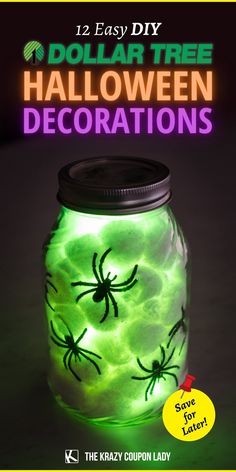 a green mason jar with spider decorations on it and the text dollar tree halloween decorations