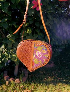 *Please advise each bag has a different flower design/color. We will send the bag at random unless you message us if you want a specific one* Beautiful hand-tooled leather purse from Mexico. Carefully handcrafted by hardworking and skilled artisans to create this beautiful purse for you. Made with real leather Adjustable Straps Made in Chiapas, Mexico 8 1/2 inches (Height) x 10 inches (Width) x 2 1/2 Depth *Please advise since our handbags are handmade with real leather. Minor wrinkles, markings Heart-shaped Multicolor Bag For Gift, Heart-shaped Multicolor Gift Bag, Heart-shaped Leather Shoulder Bag, Everyday Use Heart-shaped Leather Shoulder Bag, Heart-shaped Leather Shoulder Bag For Gift, Heart-shaped Leather Shoulder Bag Gift, Heart-shaped Brown Bag For Everyday Use, Heart-shaped Leather Bags For Gifts, Handmade Heart-shaped Bags For Daily Use