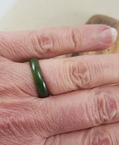 Nicely polished Jade ring... ladies size 6.5 and one size 8 , In good vintage condition ..  PLEASE SPECIFY WHICH SIZE.. Nice darker green natural jade stone ring. Classic Green Crystal Ring, Classic Adjustable Green Emerald Ring, Classic Green Stackable Rings, Adjustable Green Jade Rings, Classic Green Stackable Round Rings, Green Jade Round Band Ring, Vintage Round Jade Rings, Classic Adjustable Green Ring, Classic Green Oval Stackable Rings