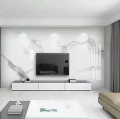 a modern living room with white furniture and marble wallpaper on the walls, along with a large flat screen tv