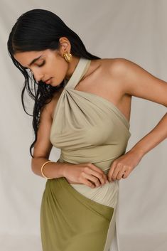 Effortless summer.The BRONWYN Slinky Halter Crop Top is a perfect blend of modern style and elegant design. This top features a halter neckline with a secure button closure at the back of the neck, ensuring a comfortable fit. The front ruching adds a chic detail, enhancing the overall look. The open back, accented by a tie back closure, creates a striking silhouette that's both bold and sophisticated. Pair it with the Bronwyn Slinky Ruched Maxi Skirt With Split for a cohesive and stunning ensemb Capsule Wardrobe Accessories, Capsule Wardrobe Basics, Fun Outfits, European Summer Outfits, Dusk Till Dawn, Wardrobe Accessories, Capsule Outfits, Black Tie Wedding, Beige Dresses