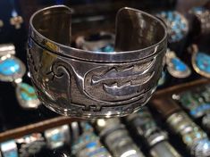 Hopi Native American Indian sterling silver 925 overlay cuff with traditional designs6.5" around plus 15/16" opening gap (***-could be closed down or flexed up some if your size wrist is close but not the same as its current size), x 1 3/8" wide20R***- This stunning piece is coming from an exciting new relationship with a well known & popular Santa Fe, NM, jewelry gallery. I will be listing many exquisite, even World Class, pieces in the near future, most at lower prices than they are offere Artisan Sterling Silver Bracelet, Artisan Sterling Silver Bracelet With Polished Finish, Unique Sterling Silver Ceremonial Bracelet, Unique Sterling Silver Bracelet For Ceremonial Occasions, Native American Bird, Jewelry Gallery, New Relationship, Stamped Rings, Santa Fe Nm