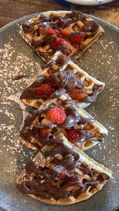 chocolate covered waffles on a plate with strawberries