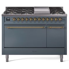 a blue stove top oven sitting on top of a white countertop with gold trimmings